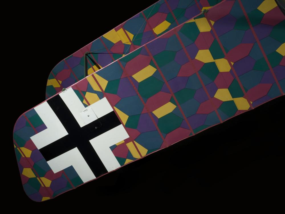 Black cross and multicolored lozenge camouflage on wing of Albatros D.Va aircraft