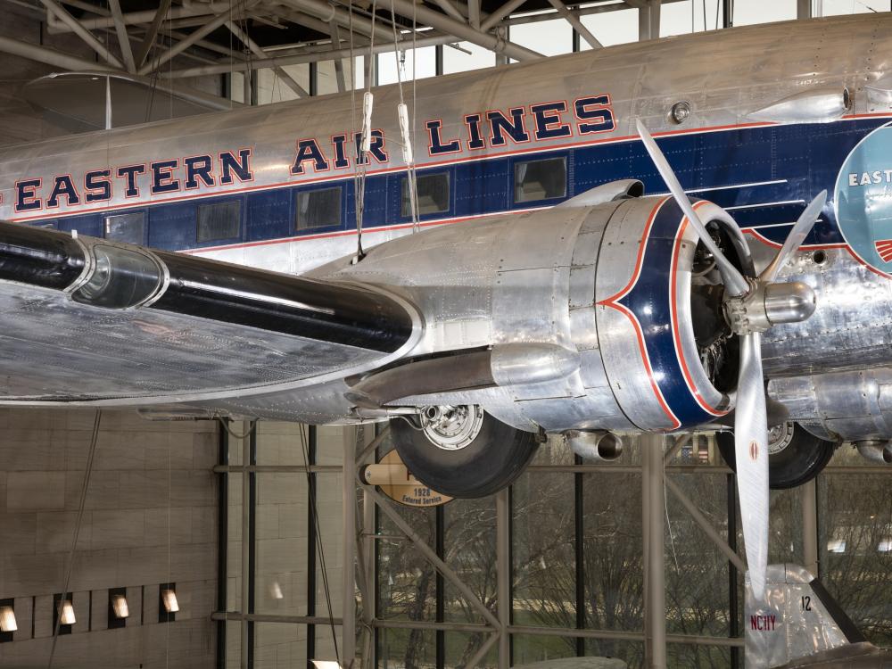 Side propeller and body of Douglas DC-3 aircraft hanging in museum