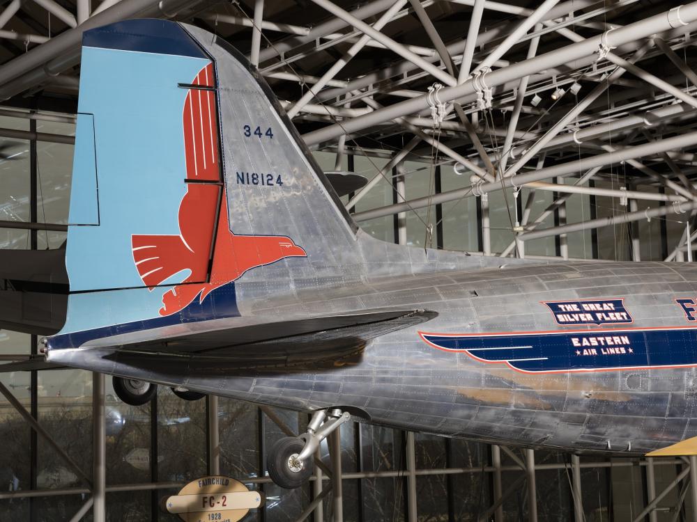 Blue tail of Douglas DC-3 aircraft with red eagle detail