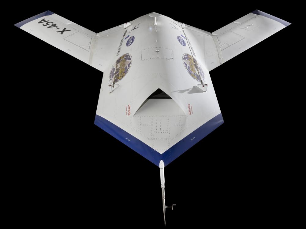 Top front view of white and blue Boeing X-45A aircraft