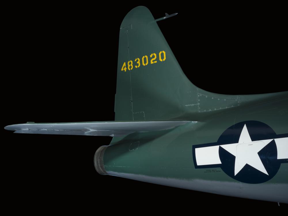 Tail of green Lockheed XP-80 "Lulu Belle" aircraft with United States Air Force insignia on body