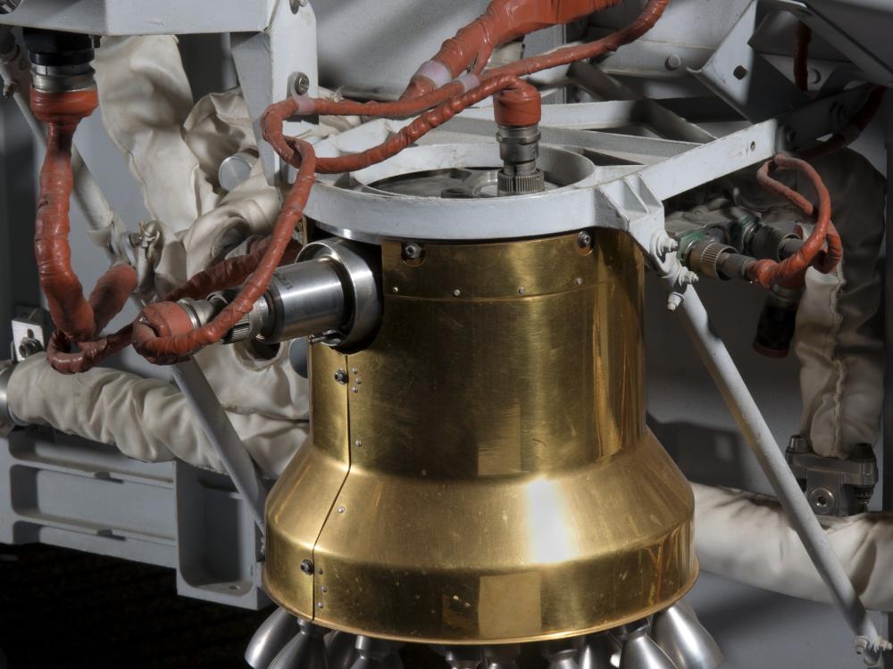 Bell-shaped engine with copper colored wiring on Viking Mars Lander