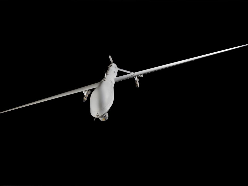 White General Atomics MQ-1L Predator A UAV hanging in museum