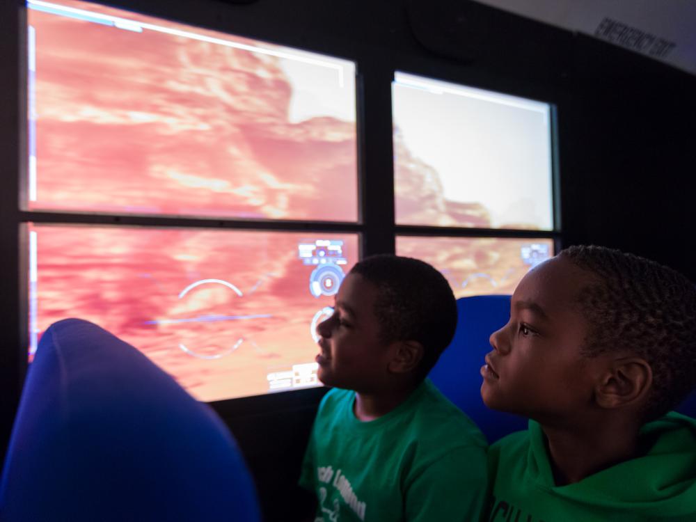 Two students on Mars Experience Bus