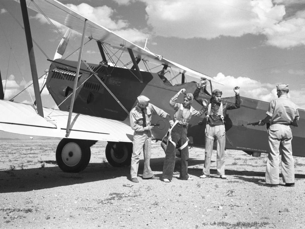 Army aviators pretend to be aerial drug smugglers in the late 1930s during a Coast Guard exercise.