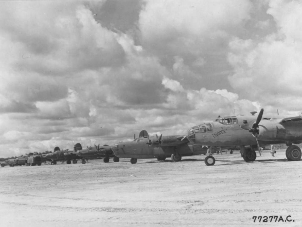 B-24s, B-25s, and B-26s sit on the ramp at Val De Case Airfield