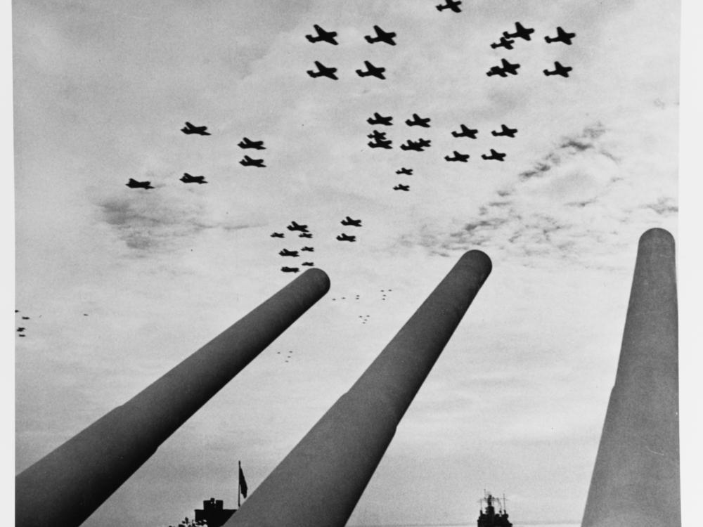 Carrier airplanes seen over the USS Missouri’s guns