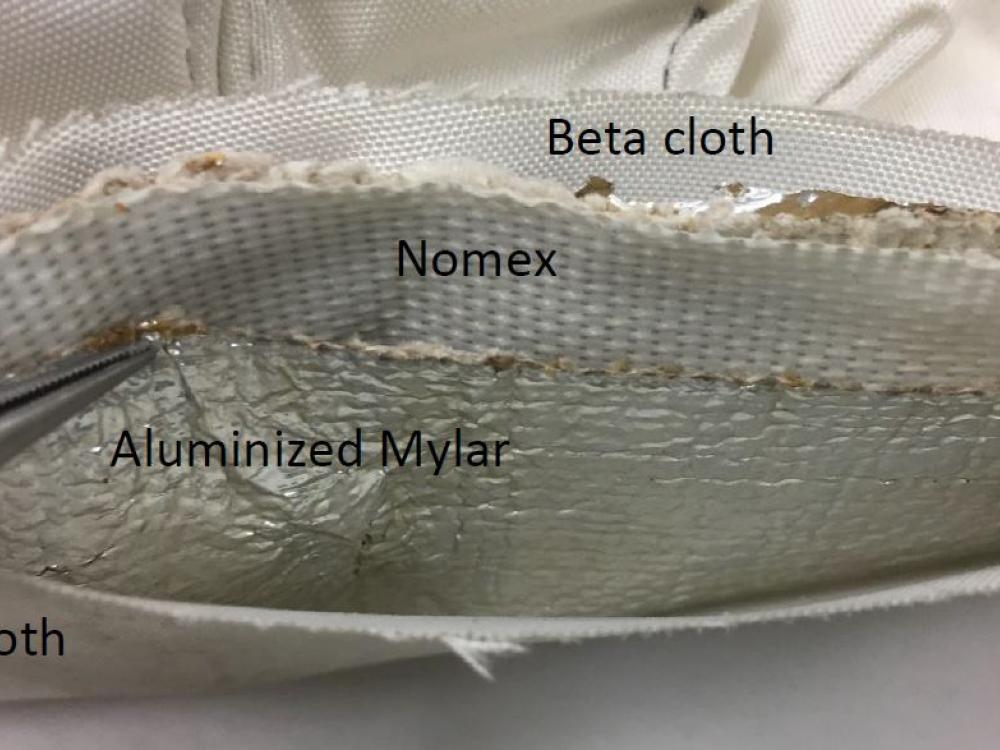 Detail view of the layered construction of the medical kit container. 