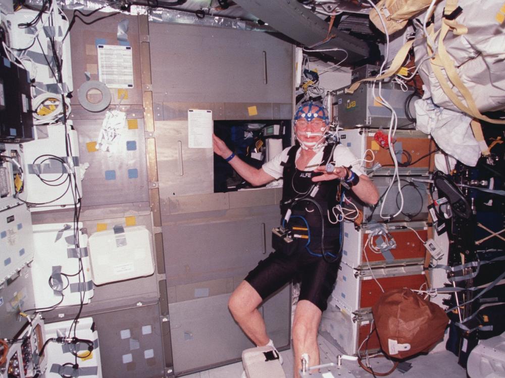 John Glenn on STS-95 wearing experiment sensors and other equipment. 