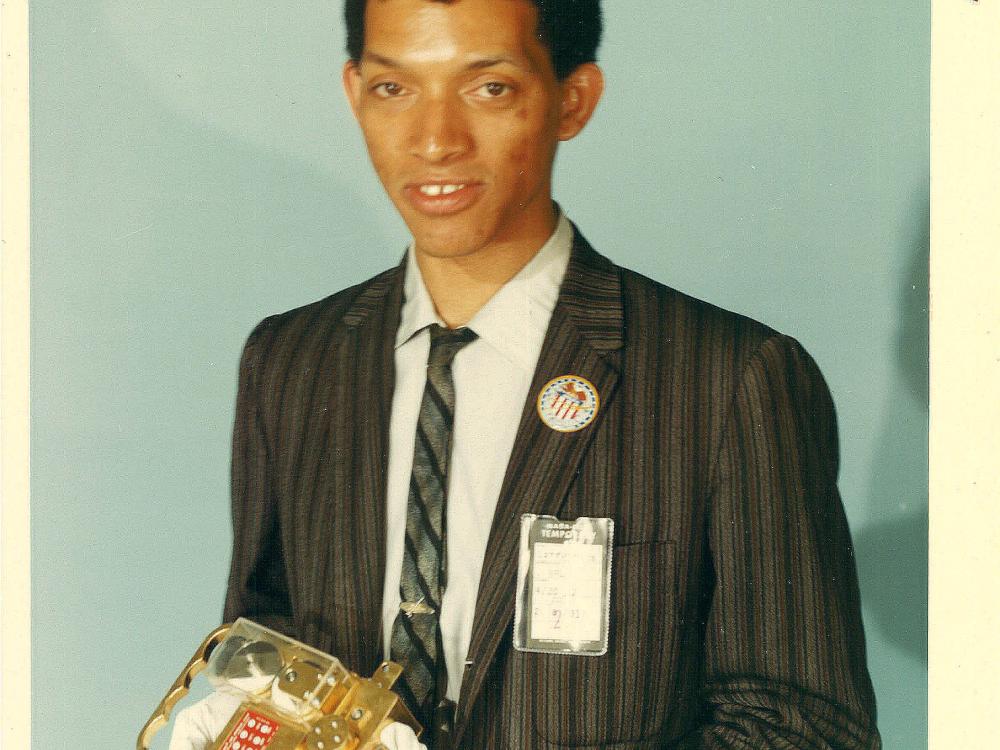 Portrait of Carruthers holding film transport. 