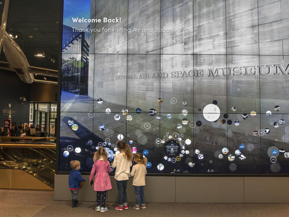 Children try out an interactive display in the Boeing Milestones of Flight Hall 