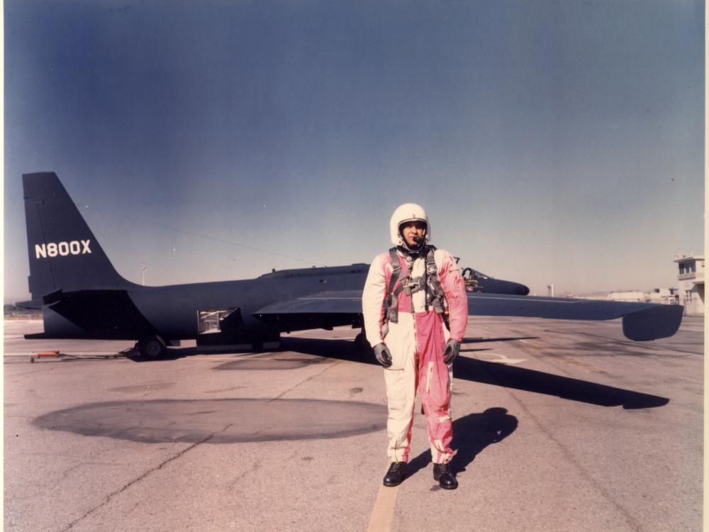 Man in red and white overals in front of U-2