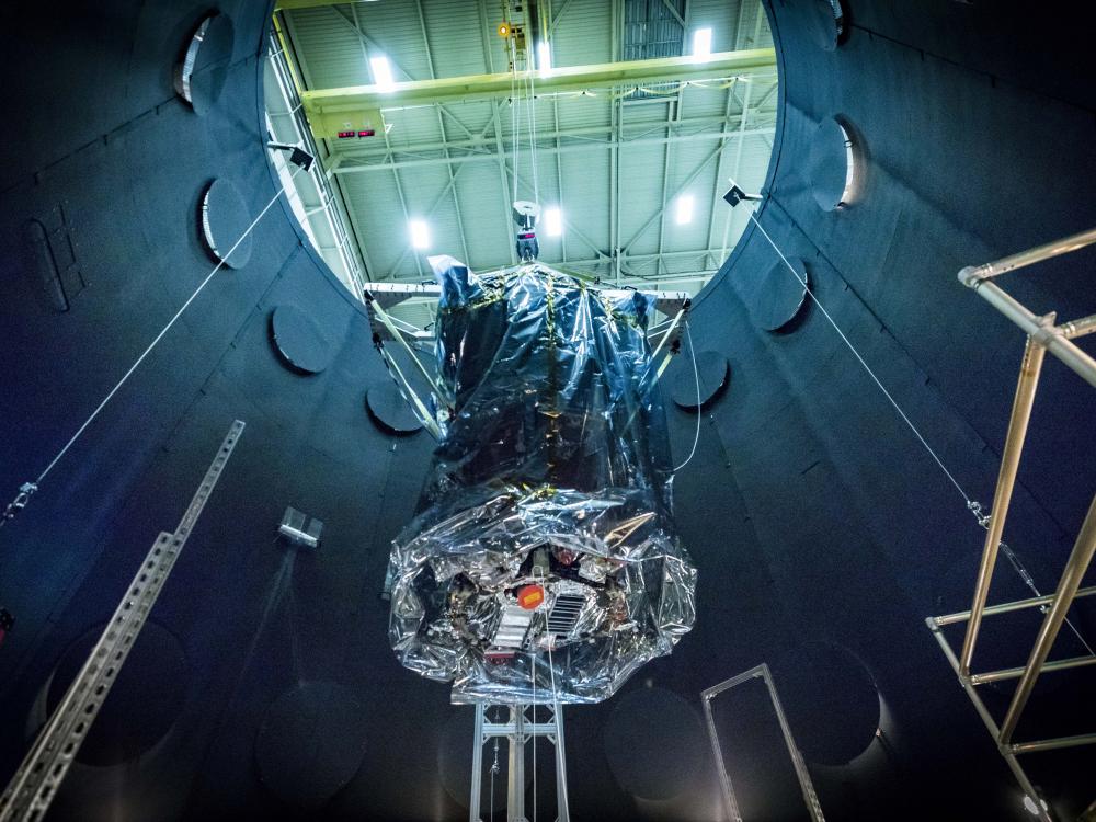 The Parker Solar Probe being lifted out of a vacuum testing chamber 