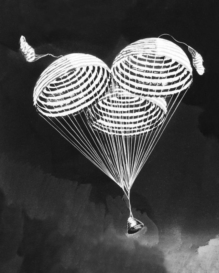 An illustration showing three parachutes deployed from the top of the lunar module. 