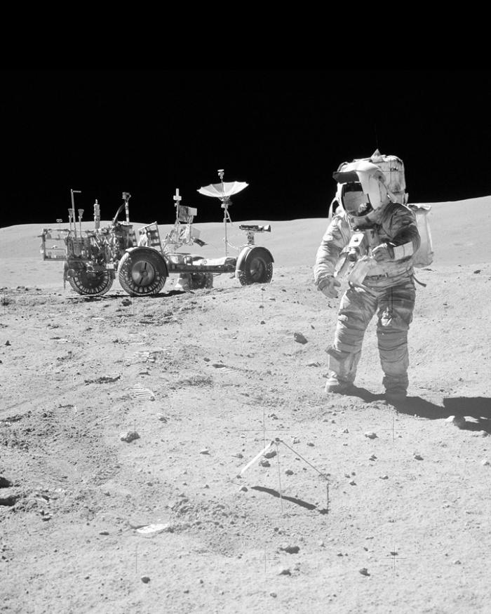 An astronaut and equipment on the surface of the moon.
