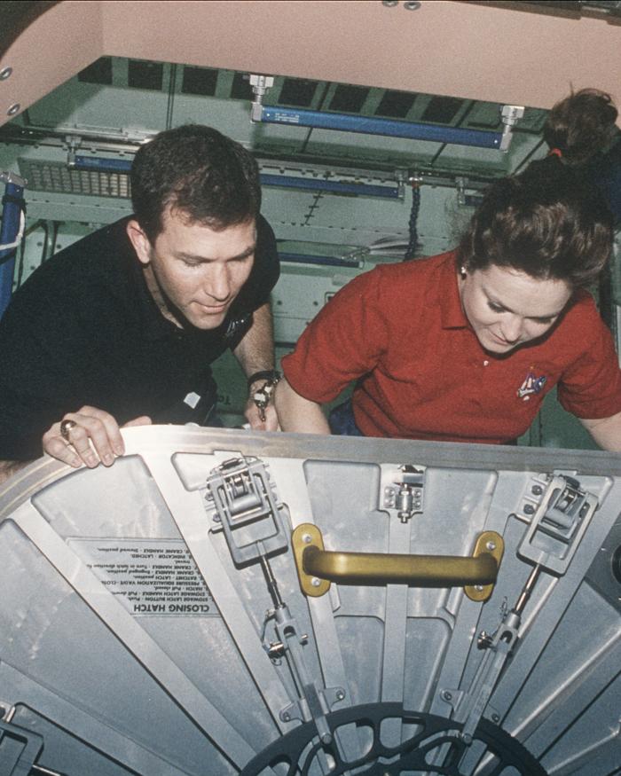 STS-96 Astronauts Adjust ISS Unity Hatch