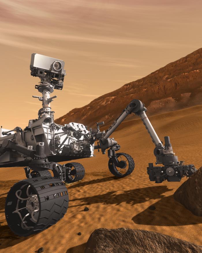 Artist concept of rover Curiosity performing tasks on the surface of Mars.