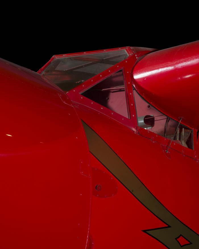 Outside of cockpit of red Amelia Earhart Lockheed Vega 5B aircraft