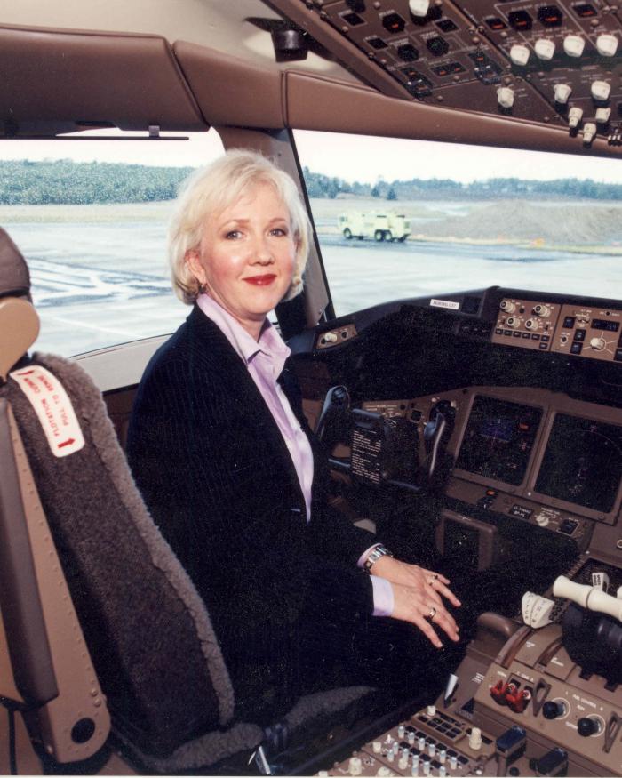 Suzanna Darcy-Hennemann in the cockpit of a plane. 