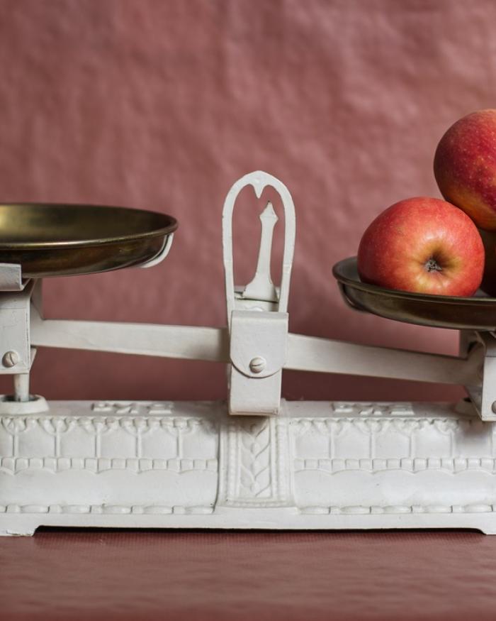 Photo of apples sitting on a scale