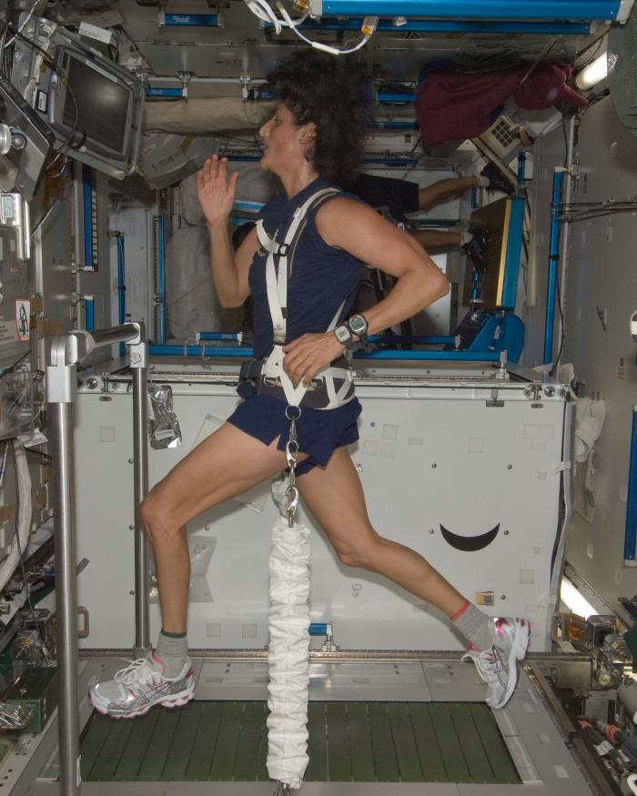 NASA astronaut Sunita Williams exercising on a treadmill aboard the International Space Station, 2012.