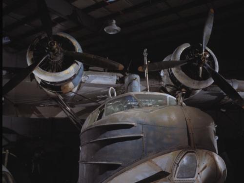 Dramatic photo of the Sikorsky JRS-1 in a hangar. 