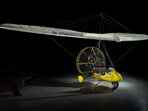  Yellow painted French two-seat flying wing ultralight inside the museum. 