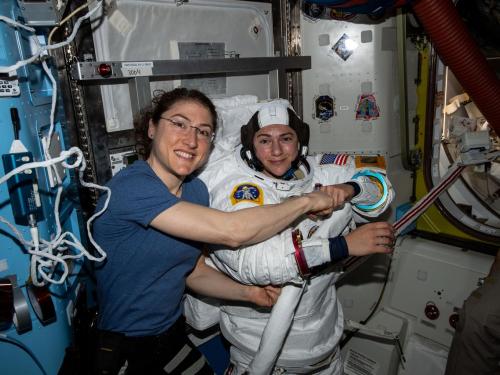 Astronaut Christina Koch (left) poses for a portrait with flight engineer Jessica Meir