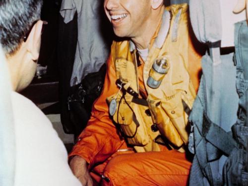 Alan Shepard onboard a helicopter as he is transported from the aircraft carrier following Freedom 7 splashdown