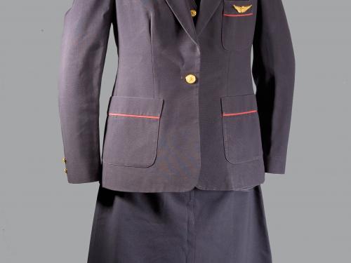 A photo of a dark colored formal uniform on a mannequin. 