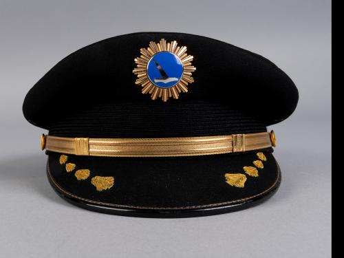 A front few of hat from an airline uniform compared side by side with a bottom view.