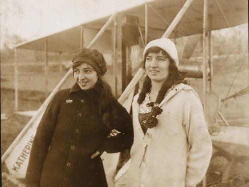 Katherine Stinson (left) and Marjorie C. Stinson (right) posed standing in front of Katherine's Wright Model B, circa 1913 