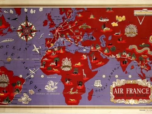 A map of the world in purple and red depicts route maps with white lines and dots. Small drawings throughout represent destinations. An elaborate compass is at upper left; partial text at lower right, "AIR FRANCE" in white serif text and "RÉSEAU AÉRIEN MONDIAL" in gold and black serif text are enclosed within a decorative rectangle. A gold border surrounds the entire poster illustration.