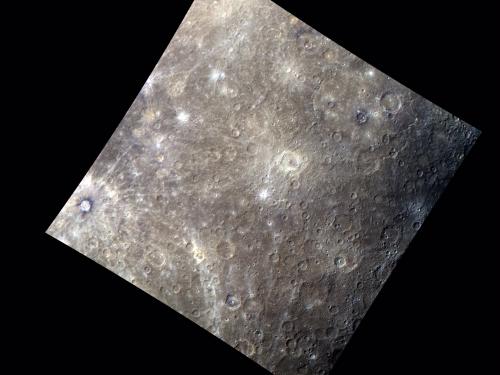 An image of Mercury's surface featuring difference shades of browns and grays.