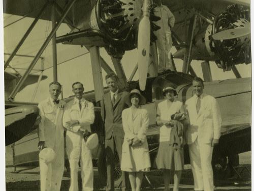 Photo of Charles and Anne Lindbergh with Betty and Juan Trippe and Pan American Airways personnel by a PAA S-38 amphibian.