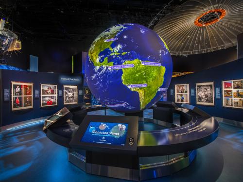 Large spherical Earth interactive in the middle of an exhibition.jim 
