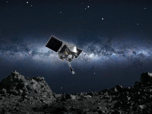 Graphic of a spacecraft above the surface of an asteroid. 