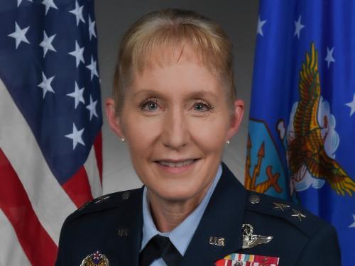 A middle-aged woman wearing a military uniform