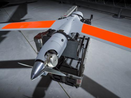 Wings of a grey and orange unmanned aircraft 