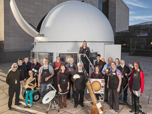 Staff and volunteers outside of the Phoebe Waterman Haas Public Observatory. 