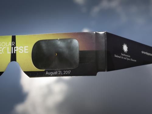 View of a partial eclipse through eclipse viewing glasses