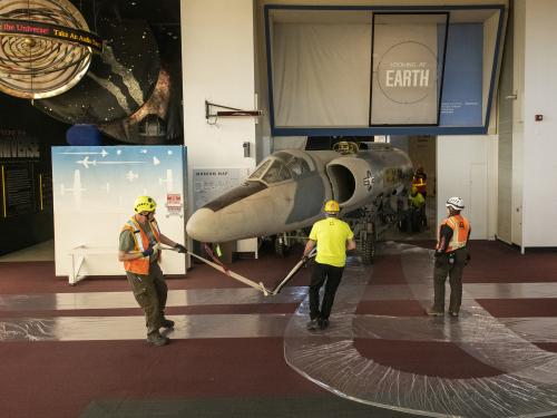 Contractors hand-tow the Lockheed U-2 fuselage.