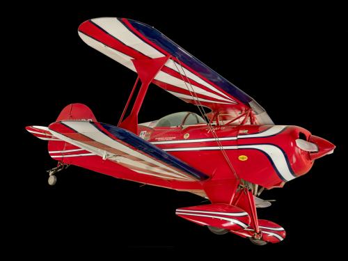 Red, white, and blue painted aerobatic biplane. 