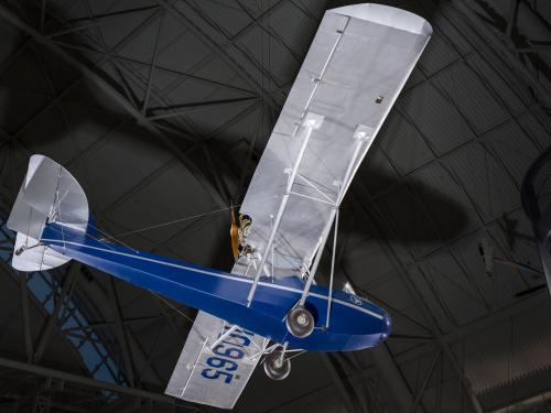 View of a blue painted fuselage on an airplane. 