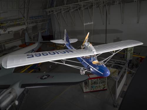 Blue and silver painted aircraft hanging in the museum. 