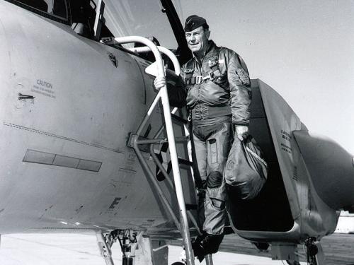 Chuck Yeager stands on ladder outside F-15B