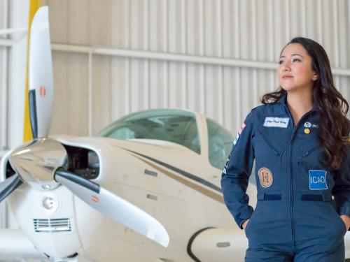 Shaesta Waiz stands in front of airplane