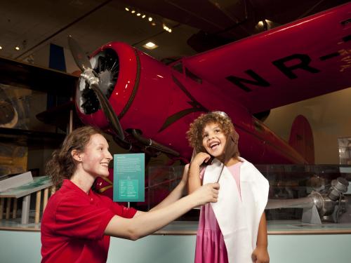 Museum Explainer with Young Visitor