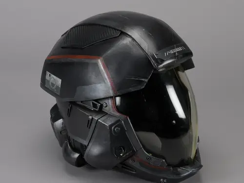A helmet that appears as a full head motorcycle helmet, with a hard shell that covers the top of head and back of head, and a clear facemask that covers the face. 