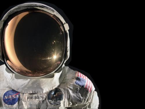 On the left side of the image, a crisp white spacesuit and helmet contrasts with the black background.